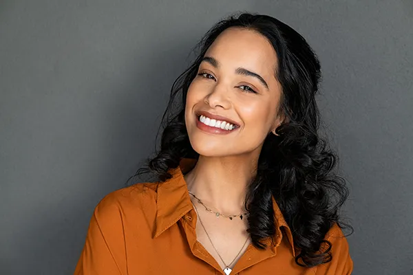 Woman showing off her brilliant teeth with a smile.