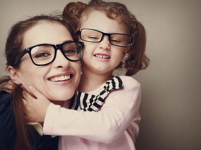 woman smiling with young girld